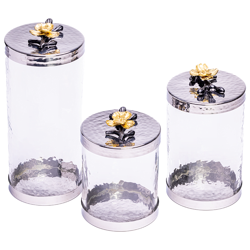3 canisters with gold and black flower handle