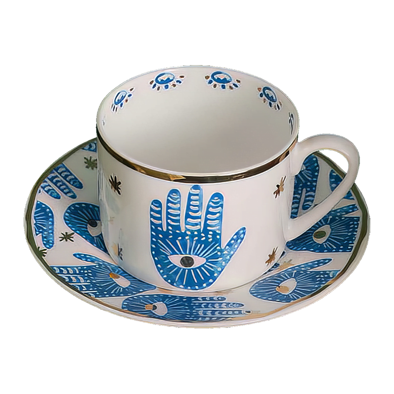 A blue and white Hamsa Blessings Set cup and saucer.