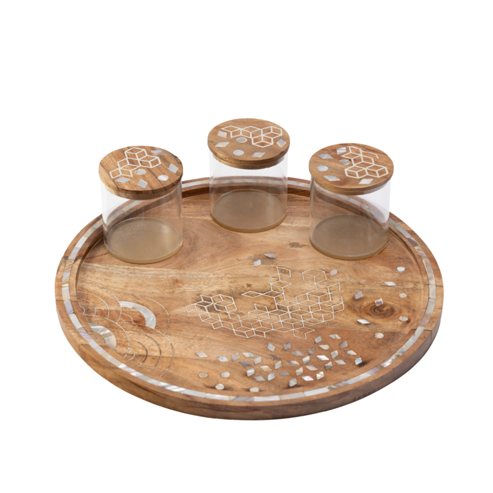 round wooden tray with 3 canisters adorned with mother of pearl inlay.